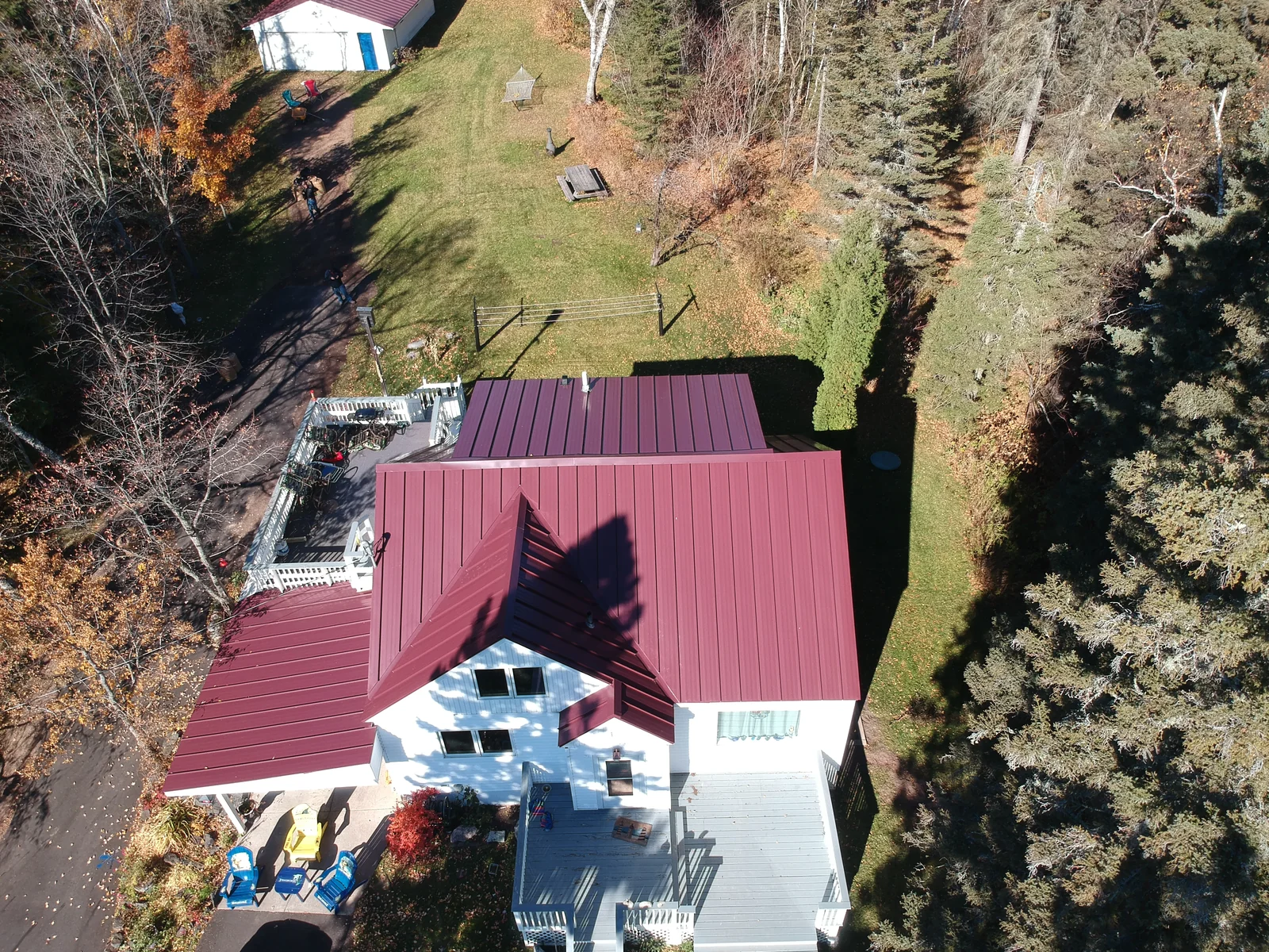 Overhead look at the ridge line and seams of the red metal roof.