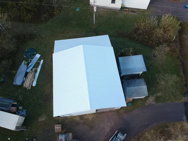 Isanti White Screw-Down Pole Barn — Collins Roofing