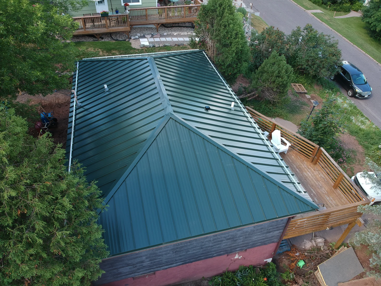 Angled overview of the green roof above the wood deck and backyard
